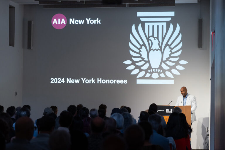 Annual meeting presentation, Greg Switzer behind the podium