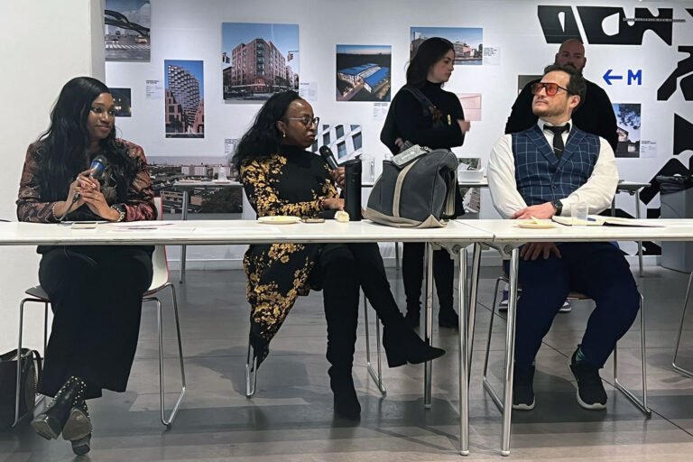 AIANY Civic Leadership Program development session in progress, with several people seated at along a table engaged in discussion and listening